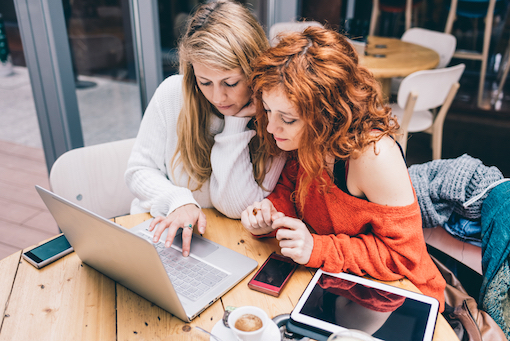 Two women on laptop